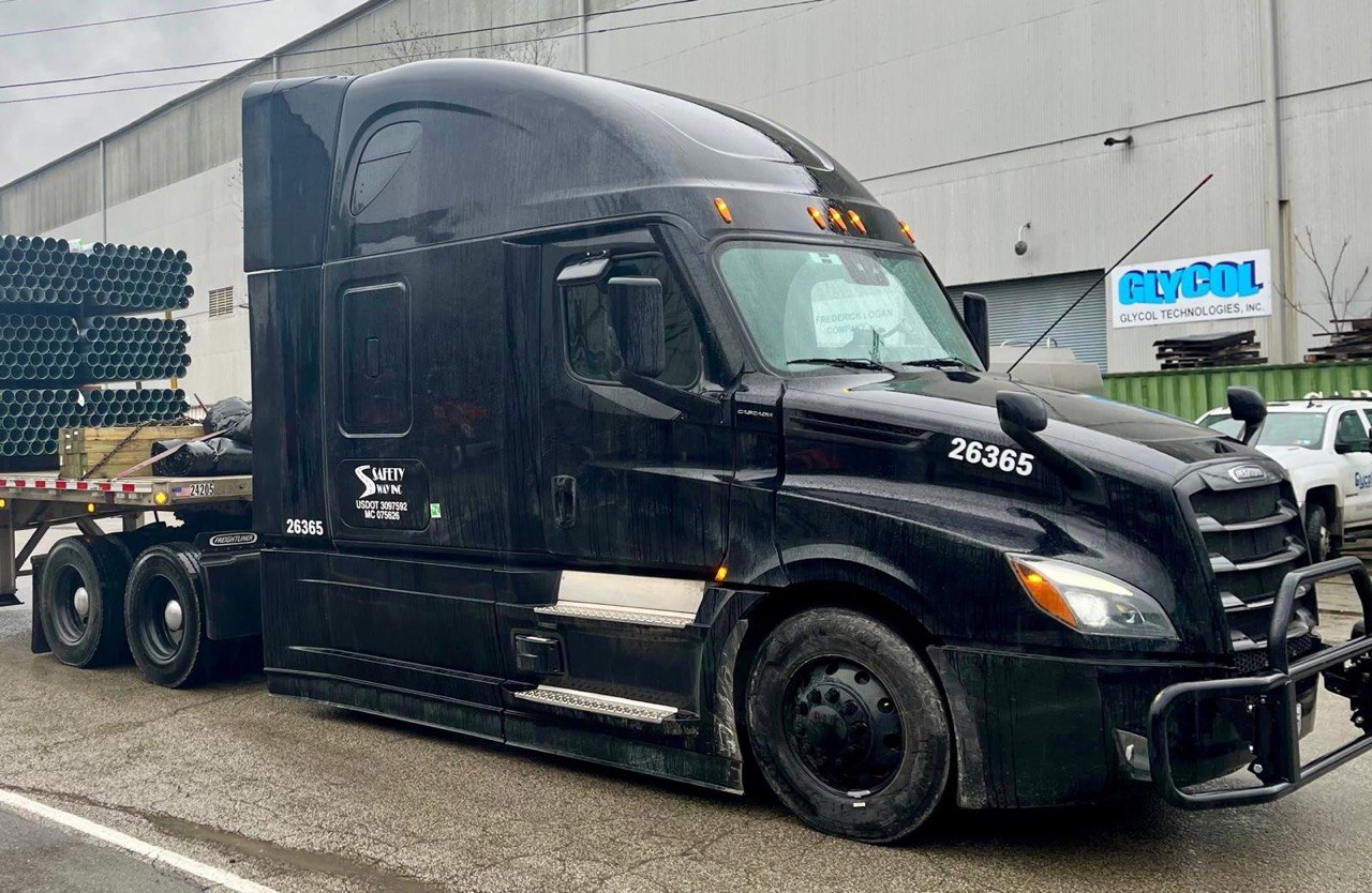 Freightliner Cascadia with steel flatbed cargo
